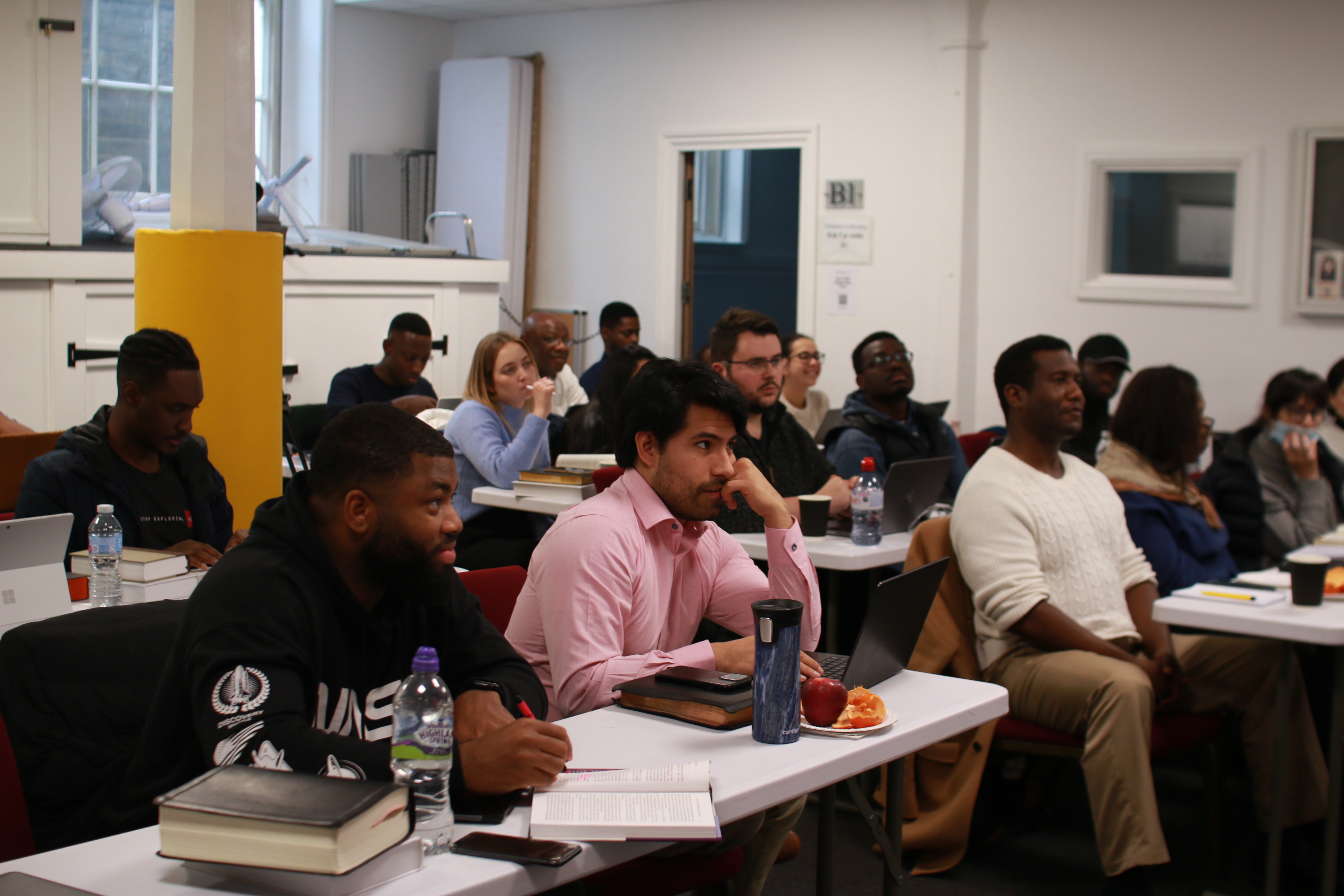 The Hermeneutics and Theology Survey class sitting and learning